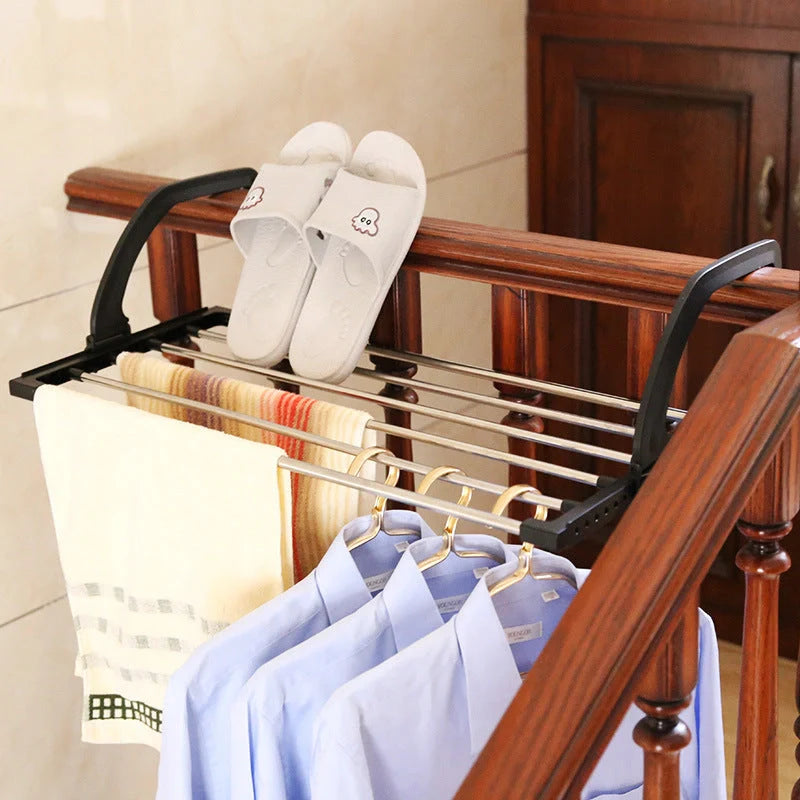 Foldable stainless steel balcony drying rack in black, perfect for saving space while drying clothes and shoes