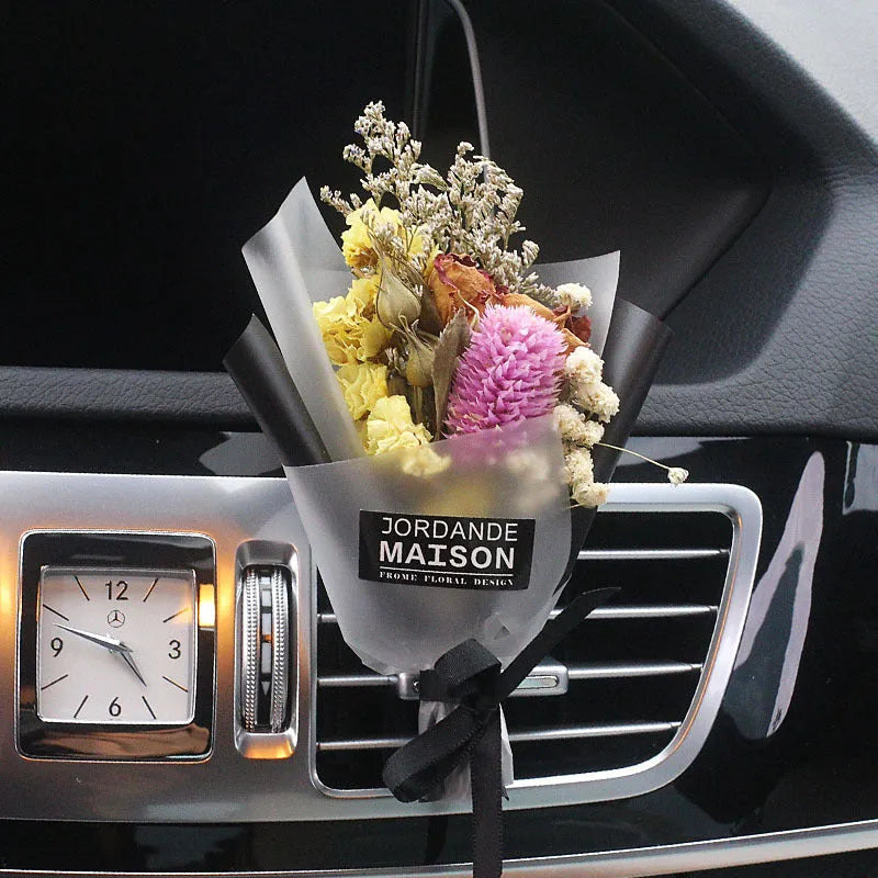 Mini dried flower bouquet mounted in car air vent for decorative aromatherapy