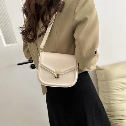 Soft PU leather messenger bag with clamshell opening in black, dark brown, khaki or white.