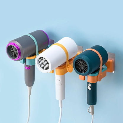 Adjustable wall-mounted hair dryer rack in orange, pink, and green