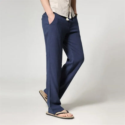 Men's straight leg casual trousers in cotton linen blend fabric showing loose fit and zip fly closure