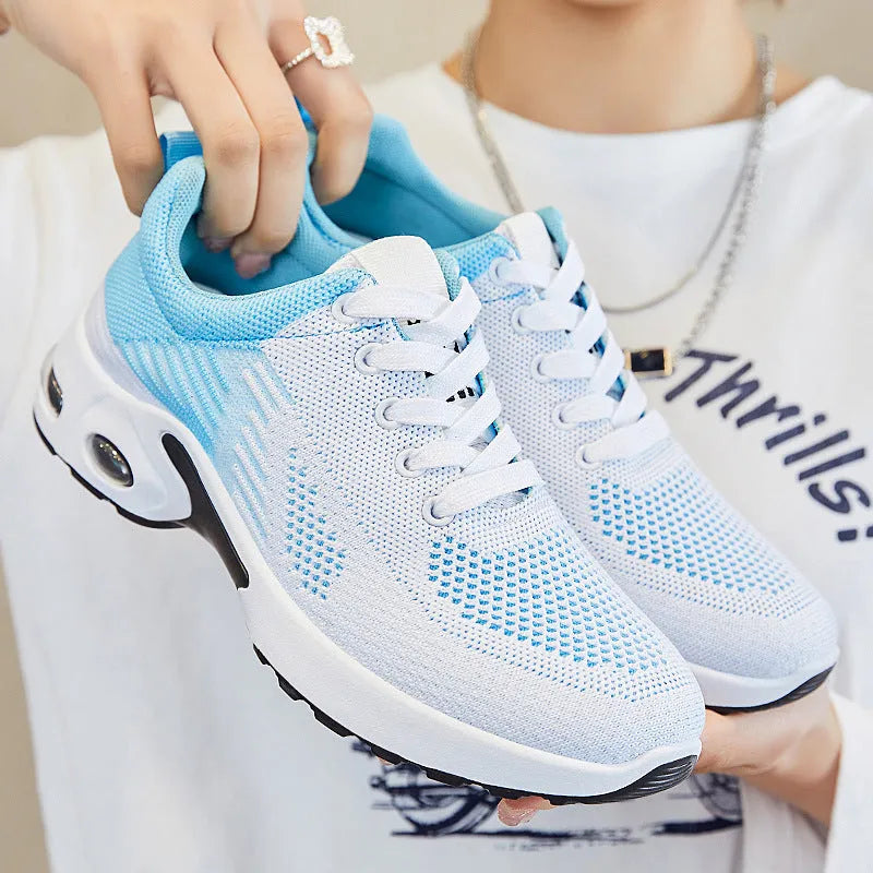 Women's striped Flyknit casual running shoes in pink, shown with a flat PVC sole and front lace-up closure.