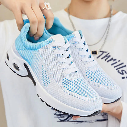 Women's striped Flyknit casual running shoes in pink, shown with a flat PVC sole and front lace-up closure.