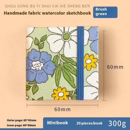 Feiluniao watercolour notebook with fabric cover, 185mm length, open to show paper for painting.