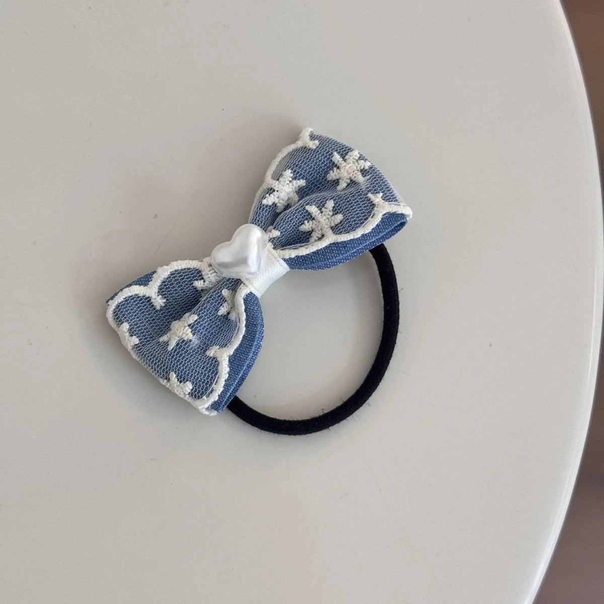Cloth barrette hairpin set showing blue bow, beige lace, and pearl butterfly designs