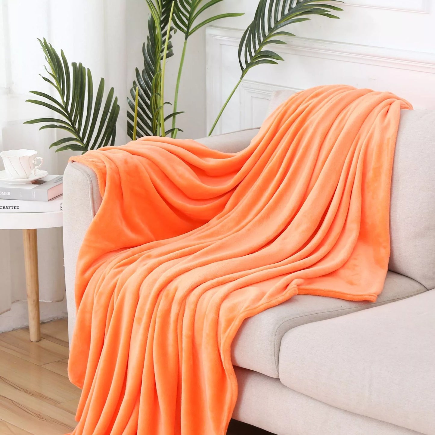 Solid color flannel blanket in various sizes and colors, made from durable polyester fiber