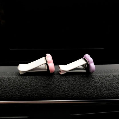 Resin car fragrance clip in light green colour showing 17mm x 27mm dimensions on car air vent