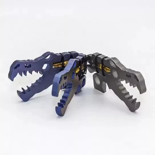 Dinosaur Head Tool in TC4 titanium, available in grey, blue, and copper