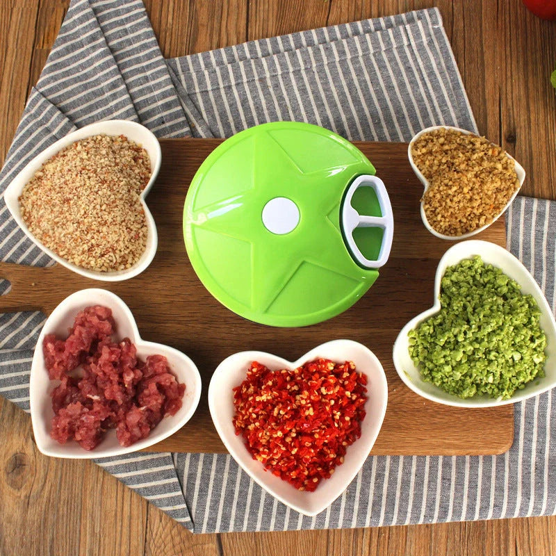Manual vegetable fruit shredder with stainless steel blade on kitchen counter