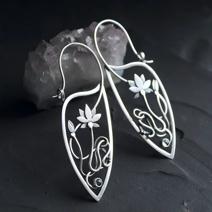 Silver electroplated alloy lotus vine earrings with geometric flower design and round rhinestone details