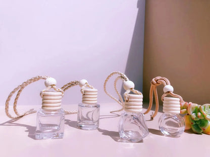 Car perfume pendant in four glass bottle styles: cylinder, diamond, flat drum, and square