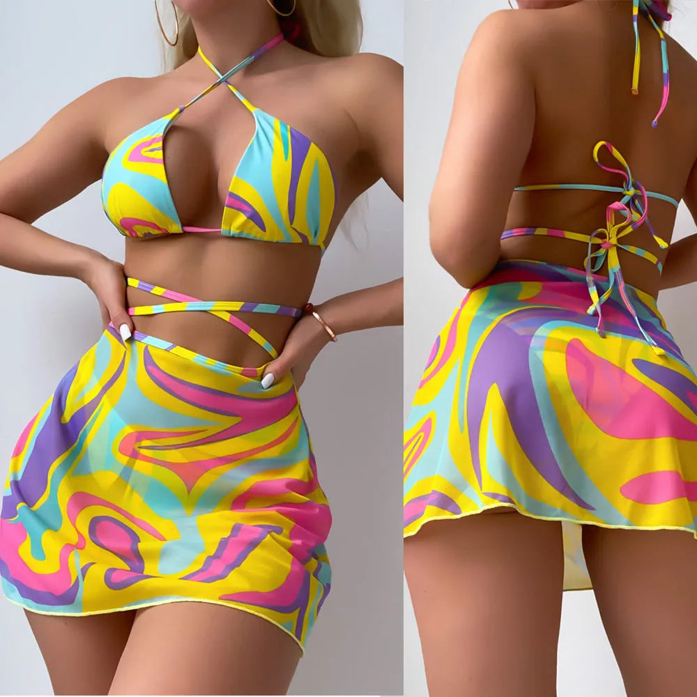 Yellow striped halter neck swimsuit with lace-up front and matching high-waisted skirt and shorts