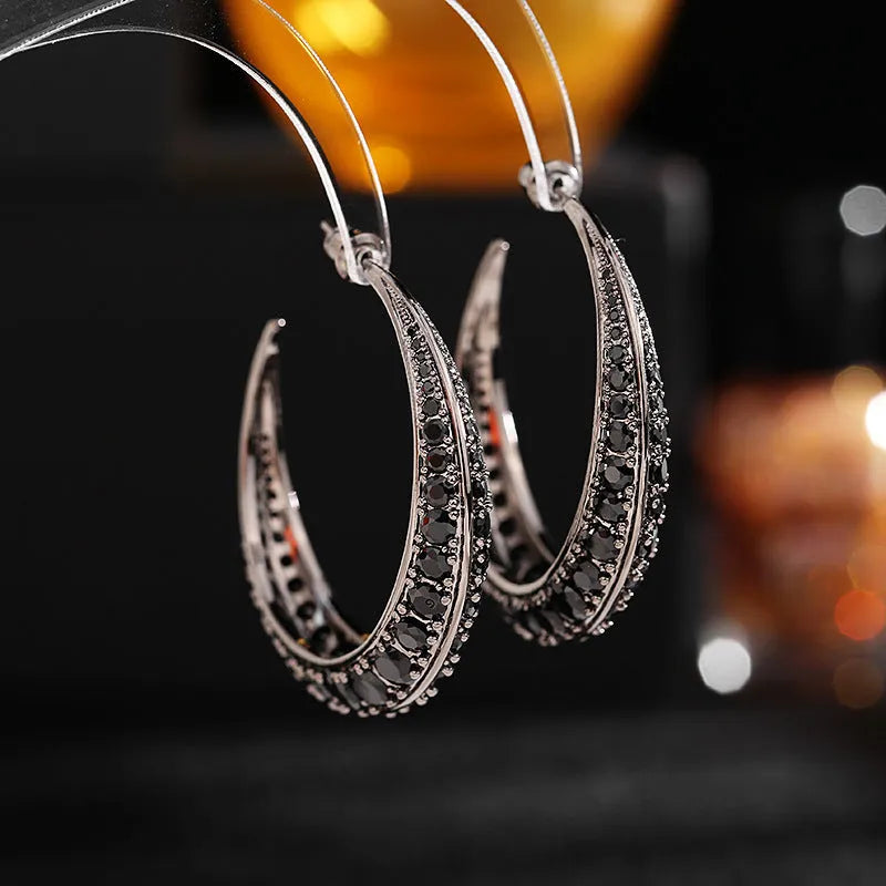 Geometric women's hoop earrings in gold white, purple, green, black, or silver white zirconium plating.