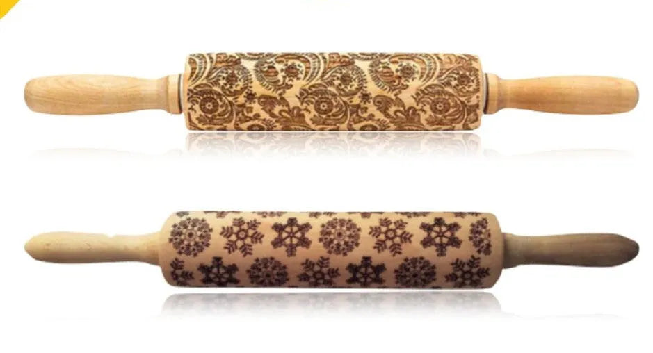 Wooden rolling pin with engraved Christmas patterns including reindeer and snowflakes on a 45cm long barrel.