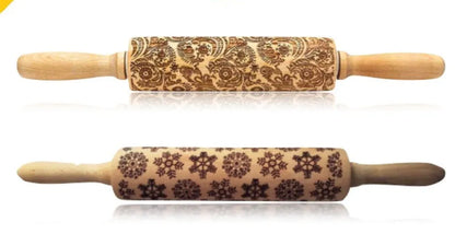 Wooden rolling pin with engraved Christmas patterns including reindeer and snowflakes on a 45cm long barrel.