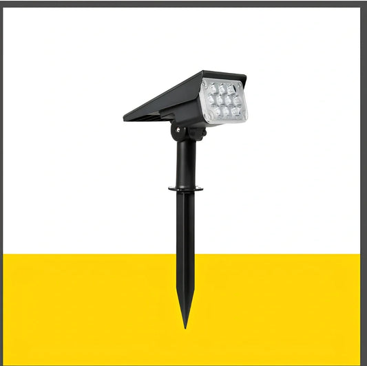 Adjustable solar garden light with black ABS/PC housing and directional spotlight head