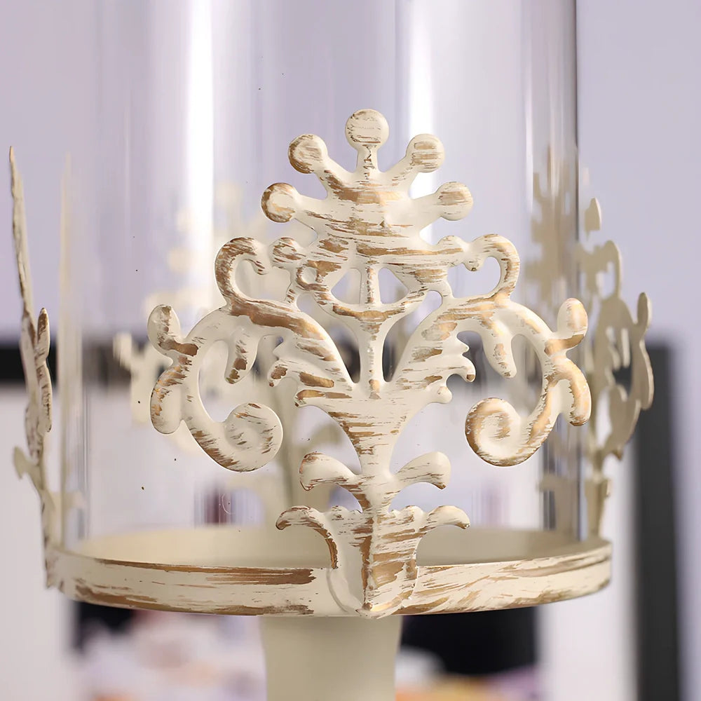 Iron candle holder with birdcage design measuring 37cm height and carved glass version at 33cm