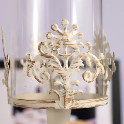 Iron candle holder with birdcage design measuring 37cm height and carved glass version at 33cm