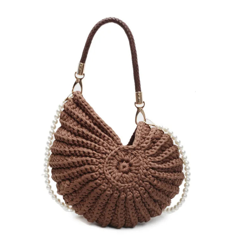 Handmade woven cloth bag with double shoulder straps in shell shape showing open pocket design