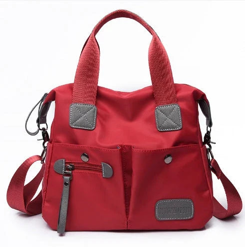 Versatile ladies handbag in various colors with multiple carry options, including handbag, shoulder bag, and crossbody styles, featuring durable construction and organizational pockets.