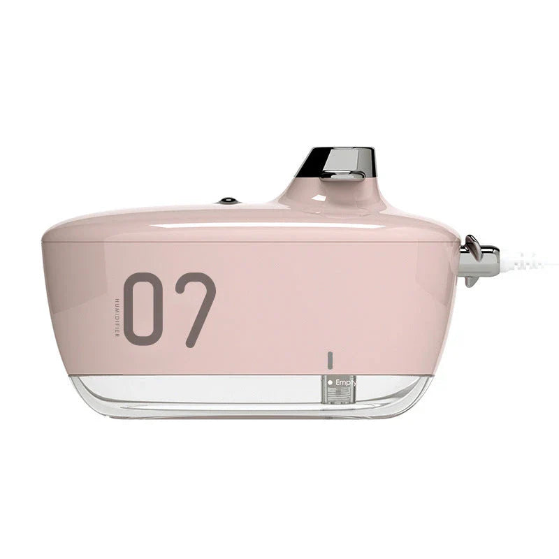 Compact, USB-powered portable air humidifier with discreet night light and silent operation for improved air quality and comfort