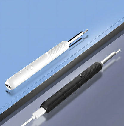 Visual ear cleaning device with camera, ear scoop attachments, and charging cable on white background