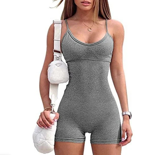 Stylish spaghetti strap jumpsuit in various vibrant colors, perfect for yoga, workouts, and everyday wear.