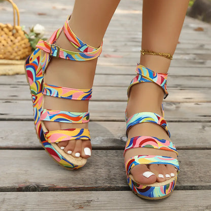 Women's buckle strap wedge sandals with fish mouth toe opening and a lightweight PU upper.