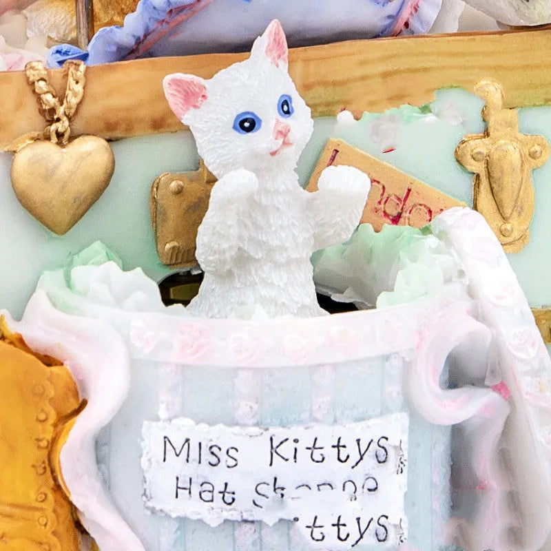 Cold porcelain cat-shaped music box with jewellery storage, rotating snowflake light, and mechanical movement