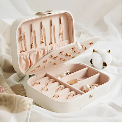 Three-layer travel jewellery box with PU leather exterior and secure closure for organised accessory storage