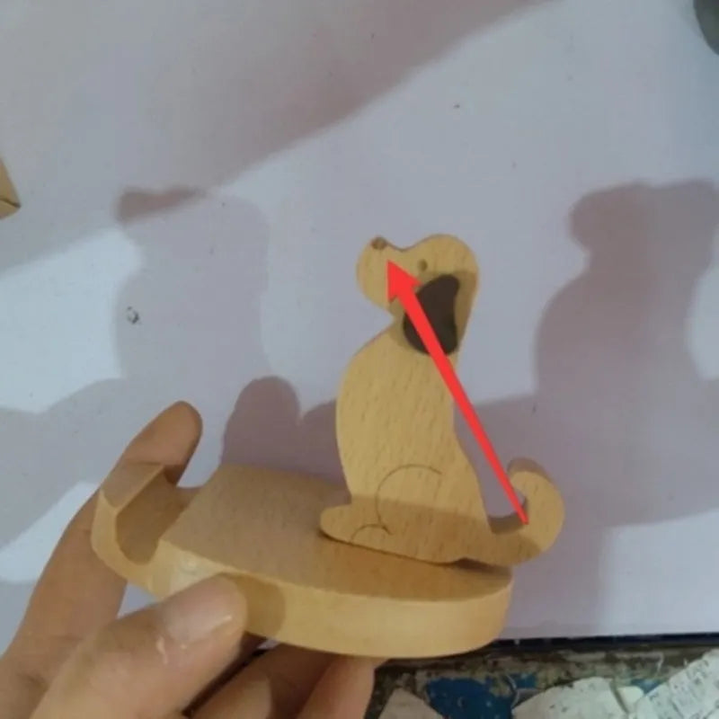 Beech wood mobile phone holder with coin slot showing adjustable angle and resin decorative elements