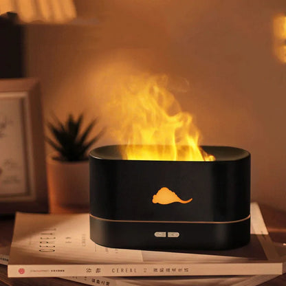 White square flame humidifier with colourful 3D light effect and crystal salt stone on a desk.