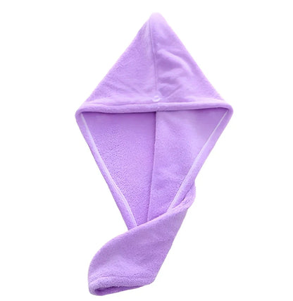 Pink microfiber hair drying towel measuring 25x65cm with button fastening shown wrapped around hair