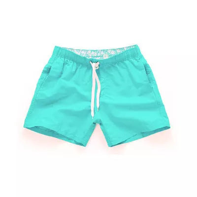 Men's summer surf shorts in various colors, made from 100% polyester for quick drying and durability