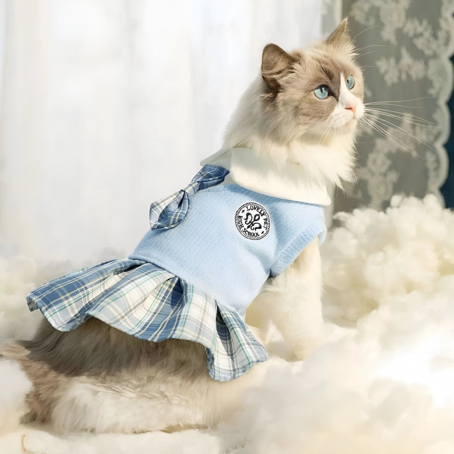 A pink, blue, or green tartan skirt for dogs and cats, shown in a princess style.