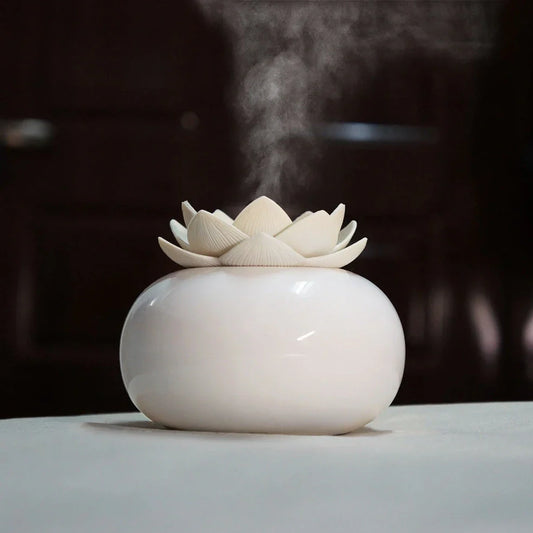 Lotus-shaped aromatherapy humidifier with ceramic base showing green and white colour option