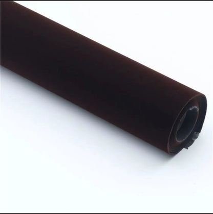 Rolls of self-adhesive leather suede in multiple colours showing texture and adhesive backing.