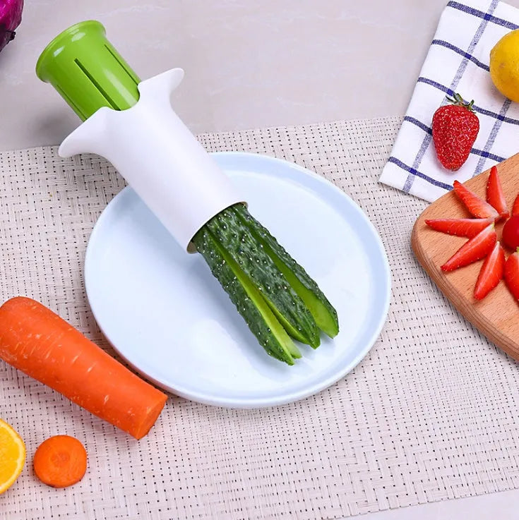 White plastic vegetable and fruit slicer with six stainless steel blades for cutting cucumbers and carrots.