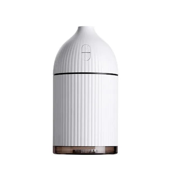 White USB-powered ultrasonic aromatherapy diffuser and humidifier with 300ml bottle and LED light on a desk.