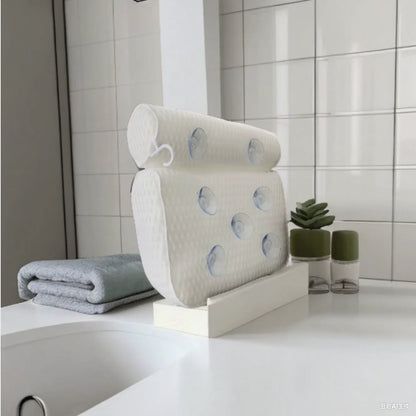 White bathtub pillow with 7 suction cups and 4D mesh design, measuring 37x34x10cm, on a bathtub