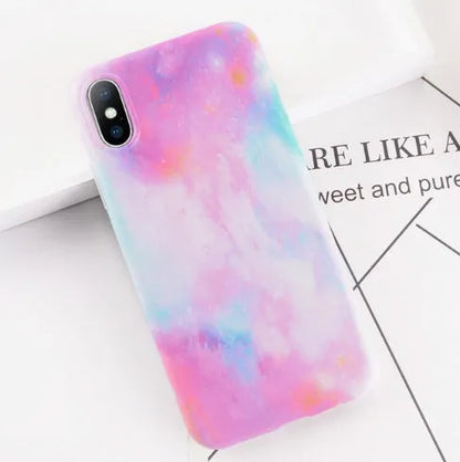 Colourful stone pattern soft back phone case for iPhone on a table.