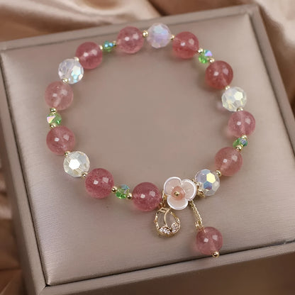 Double-layer strawberry quartz crystal bracelet with lucky cat charm and red cat's eye flowers design.