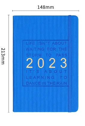Creative student almanac diary with imitation leather cover open on a calendar page.