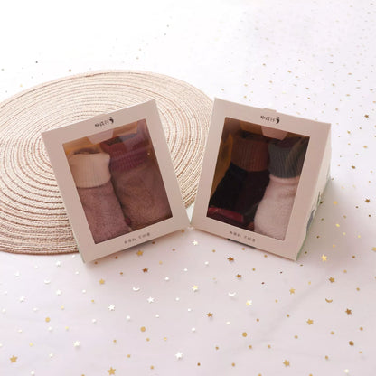 Warm baby socks in khaki, white, toon, and black colors for sizes S, M, L