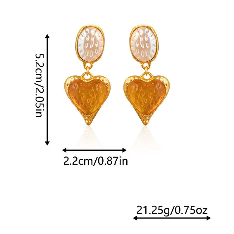 A pair of silver-tone stud earrings with a textured pleated oval love heart shape in various colour options.