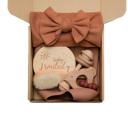 Six wooden animal bath toys floating in water with blue, brown and peach colour options