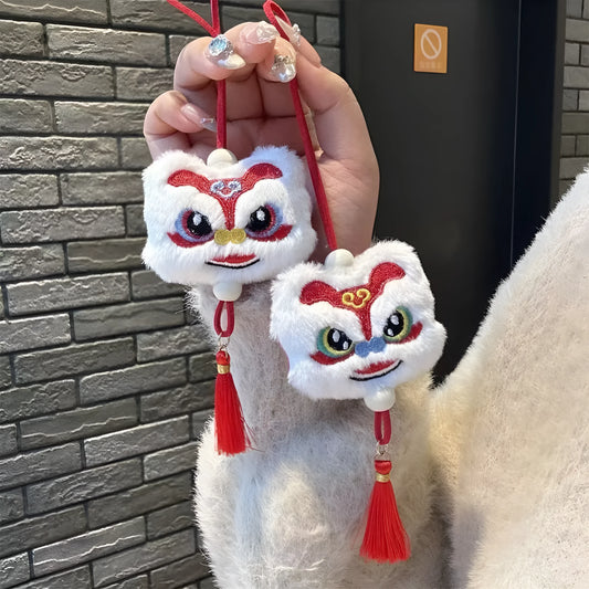 Blue and yellow Chinese style plush lion keychain ornament with star stone eyes and tassel.
