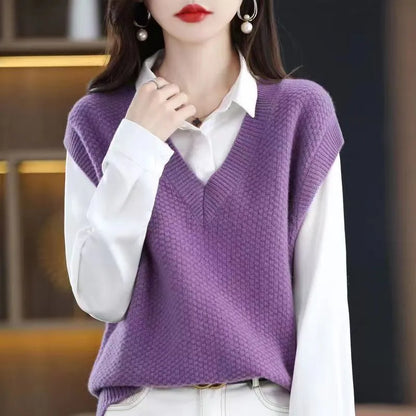 Women's creamy-white sleeveless knit vest with a raised 3D pattern, shown on a hanger.