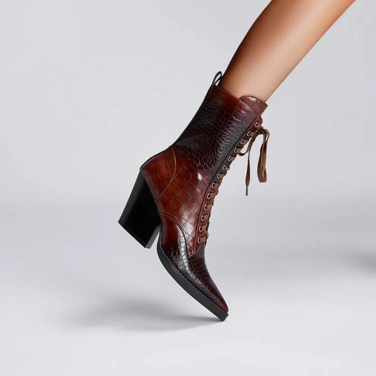 Dark brown women's ankle boots with a chunky heel, pointed toe, side zipper, and a retro stone pattern on the microfiber upper.
