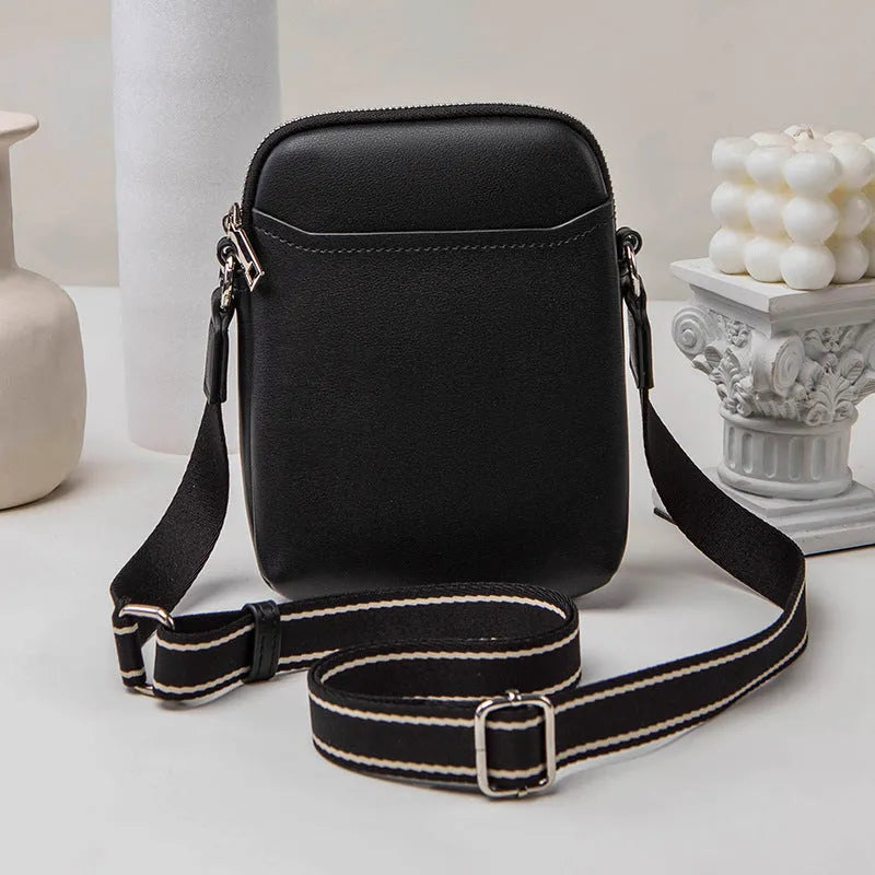 Solid colour mobile phone bag with adjustable strap showing 14.5x5.5x19cm dimensions and PU material construction